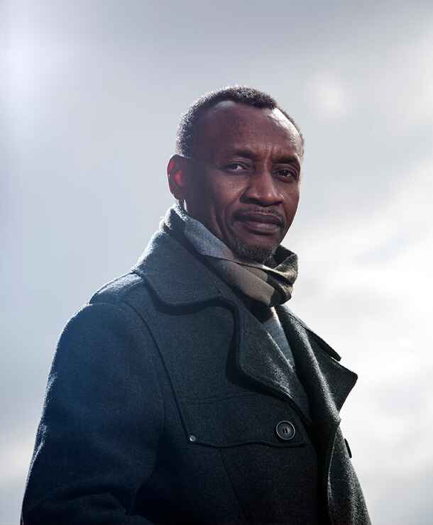 Portrait of Dani Kouyaté in a pensive pose, photographed by James Holm in 2013